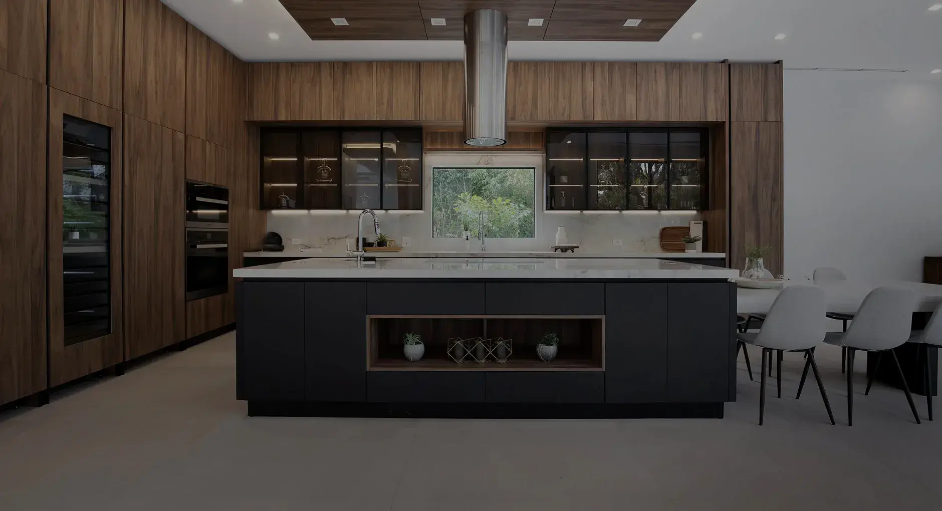 Modern Adornus kitchen with wood cabinetry and dark island